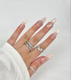 Red Cross Stitch press-on nails nude gradient with red embroidery art — Ayna.B Dubai UAE