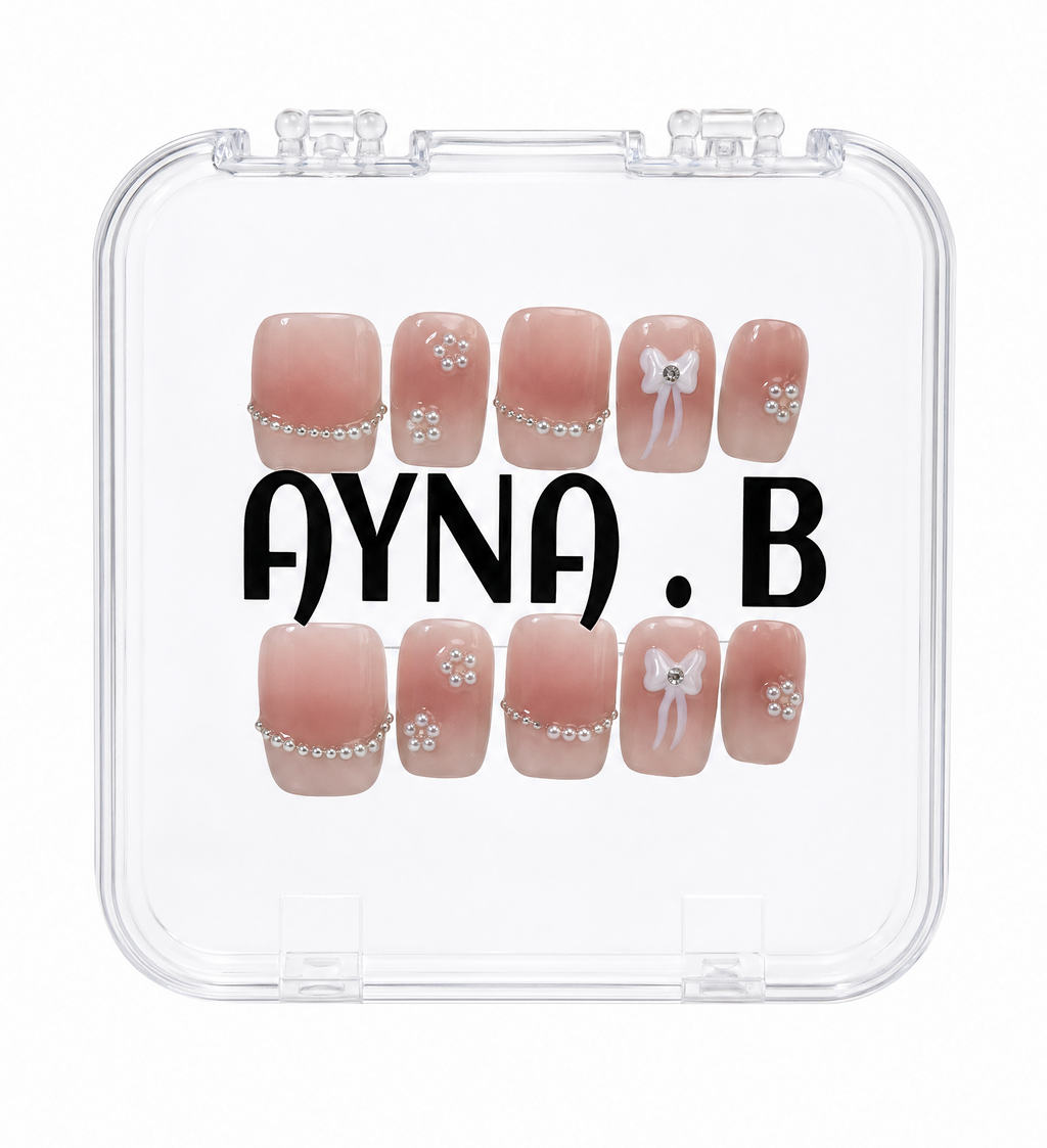 Aurora Daisy Charm press-on nails close-up — gold-capped pearls glossy finish — Ayna.B